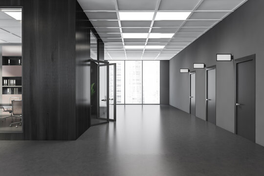 Dark grey corridor with glass details