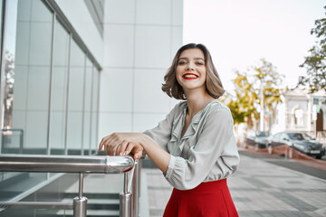 pretty woman walking in red skirt outdoors entertainment