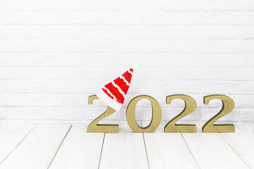 2022 new year and christmas hat on white wood table over white background  with copy space