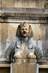 Fototapeta na wymiar Fontaine du Palmier (Fountain of the palm) placed in the historic square Place du Chatelet in Paris