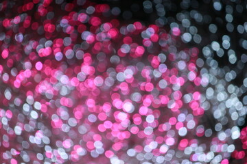 Pink and white bokeh light abstract texture background. Christmas New year and Valentine's pattern bokah, wallpaper.