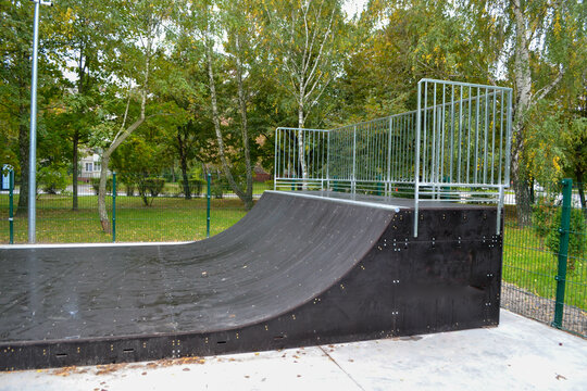 skatepark ramps in the park on autumn. High quality photo