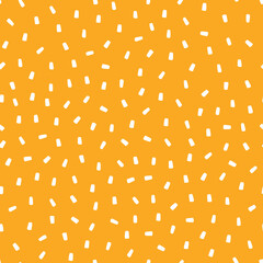 Orange seamless pattern with white sprinkles background.