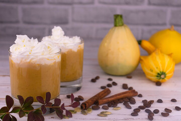 Three orange musk pumpkins on a white background.