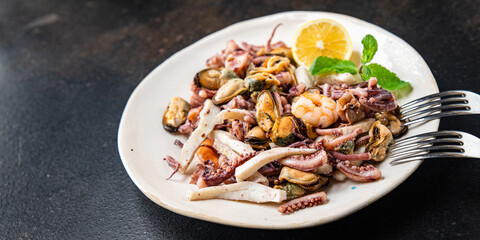 seafood mix shrimp, squid, mussel, rapan, octopus fresh portion ready to eat meal snack on the table copy space food background rustic. top view keto or paleo diet vegetarian food pescetarian diet
