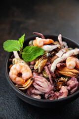 seafood mix shrimp, squid, mussel, rapan, octopus fresh portion ready to eat meal snack on the table copy space food background rustic. top view keto or paleo diet vegetarian food pescetarian diet