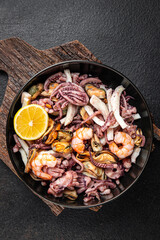 seafood mix shrimp, squid, mussel, rapan, octopus fresh portion ready to eat meal snack on the table copy space food background rustic. top view keto or paleo diet vegetarian food pescetarian diet