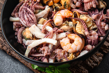 seafood mix shrimp, squid, mussel, rapan, octopus fresh portion ready to eat meal snack on the table copy space food background rustic. top view keto or paleo diet vegetarian food pescetarian diet