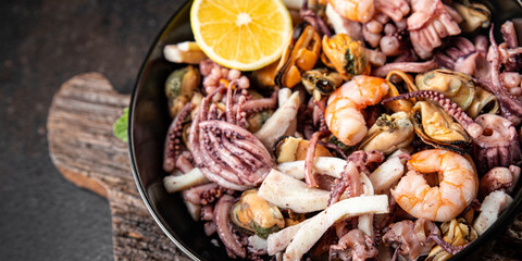 seafood mix shrimp, squid, mussel, rapan, octopus fresh portion ready to eat meal snack on the table copy space food background rustic. top view keto or paleo diet vegetarian food pescetarian diet