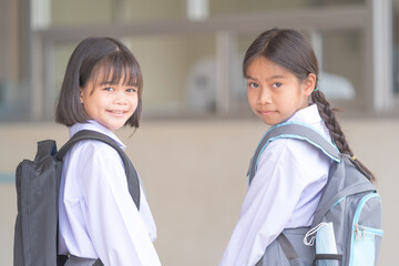 Portrait of children student in uniform and backpack Looking at camera going back to school after...