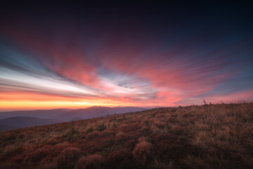 Majestic red sunset sky over the high mountains