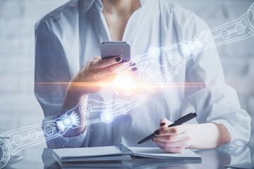 Double exposure of technology sketch hologram and woman holding and using a mobile device. Ai concept