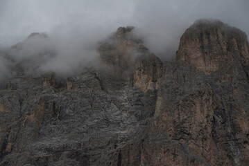 Mountain valley with beautiful house and church at sunset in autumn. Landscape with buildings, high rocks, colorful sky, clouds, sunlight. Mountains in Tre Cime park in Dolomites, Italy. Italian Alps
