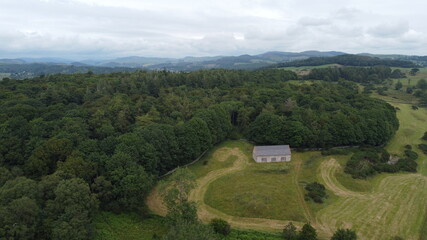 Fototapeta na wymiar Scottish woodland and farmland from drone