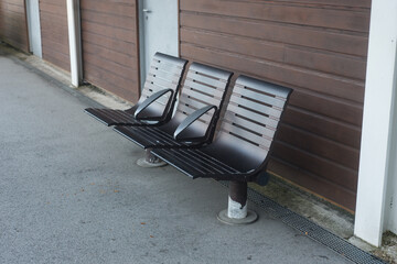 Closeup of modern metallic bench in the train station