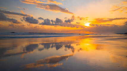 Sunset time. Seascape background. Bright sunlight. Sun at horizon line. Scenic view. Sunset golden hour. Sunlight reflection in water. Beautiful nature. Copy space. Kelanting beach, Bali