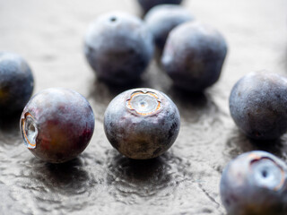 juicy ripe blueberries on a textured dark background. Close-up, berries, edaa