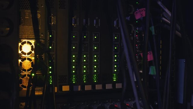 Music concert rack with blinking lapms on mixer, equaliser, compressor and amplifier. Closeup
