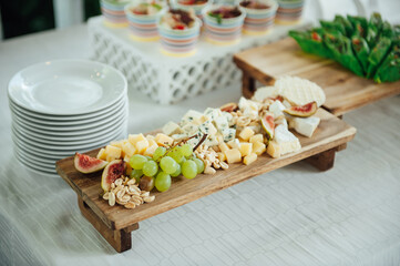 Buffet table of reception with cold snacks, meat and salads