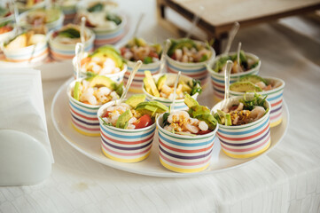 Buffet table of reception with cold snacks, meat and salads