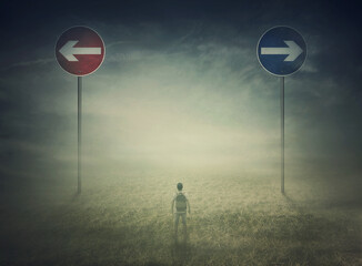 Lost man in the middle of nowhere with signposts showing two opposite directions to choose between...