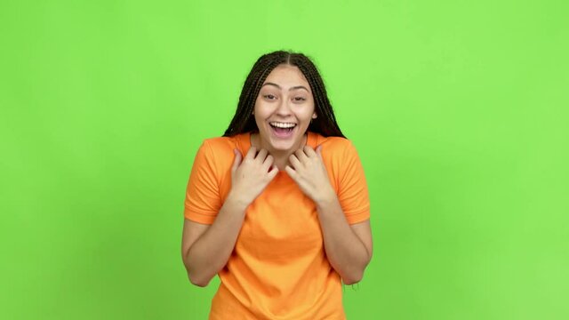 Teenager girl with braids with surprise and shocked facial expression over isolated background. Green screen chroma key