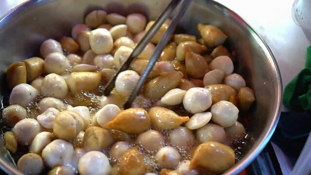 frying fish ball kikiam and squid ball with sweet and spicy sauce is a famous sidewalk staple food of the Philippines