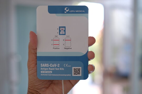Phatthalung, THAILAND - Oct 3, 2021: Close up hand hold SARS-CoV-2 Antigen Rapid Test kits for Self testing at home. Lepu Medical Technology