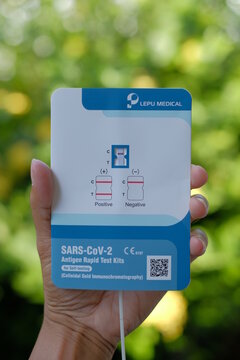 Phatthalung, THAILAND - Oct 3, 2021: Close up hand hold SARS-CoV-2 Antigen Rapid Test kits for Self testing at home and blur background. Lepu Medical Technology