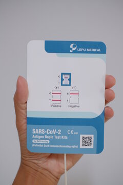 Phatthalung, THAILAND - Oct 3, 2021: Close up hand hold SARS-CoV-2 Antigen Rapid Test kits for Self testing at home on white background. Lepu Medical Technology