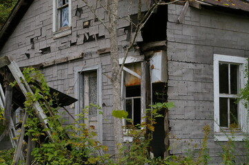 Fototapeta na wymiar abandoned house with broken windows