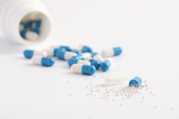 pills capsules with bottle isolated in white background