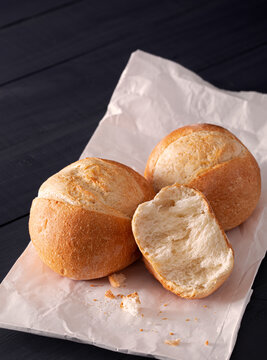 Brotchen bread rolls on white parchment paper with copy space
