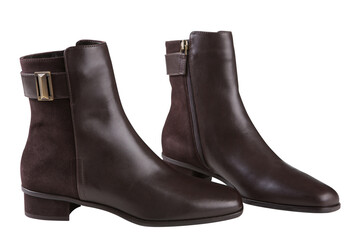 stylish brown ankle boots made of leather and suede, with a buckle, on a white background