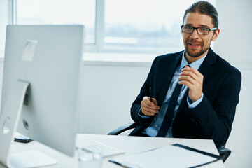 office worker at the desk with glasses work technologies