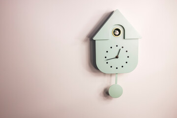 Close up view of wall cuckoo clock on colorful background. Sweden.