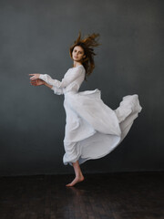 Fototapeta na wymiar Woman in white dress dance movement performance