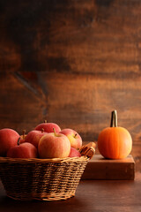  basket with royal gala apples and pumpkin