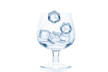 drop ice cubes in to empty Snifter or Balloon glass isolated