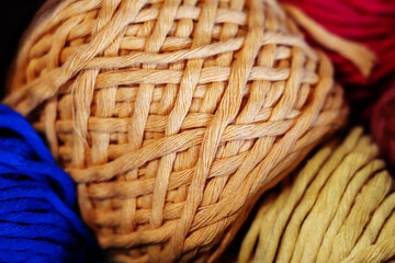 Obraz premium Woolen threads in a ball. Material for knitting clothes and various items. Close-up