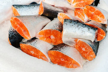 Pieces of salmon in ice crumbs. Trade in fresh seafood in a wholesale and retail network. Showcase...