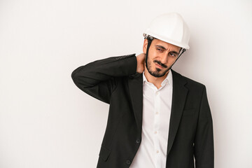Young architect man wearing a construction helmet isolated on white background touching back of head, thinking and making a choice.