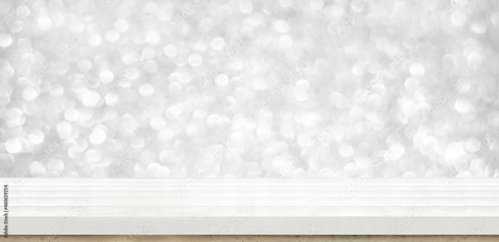 Poster wood table with sparkling silver bokeh wall background,leave space for display of product for promotion on christmas and new year holiday