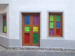 Bright window decoration against the white wall of the building