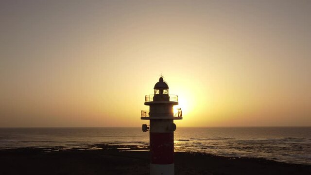 Detail of the Toston lighthouse at sunset, Punta Ballena, near the town of El Cotillo, Fuerteventura Island, Canary Islands. Spain, 4k video