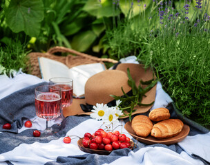 Set for picnic on blanket in lavender field