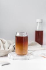 Ombre tea or coffee  in glass cup, Milk and tea or coffee in a can shaped glass