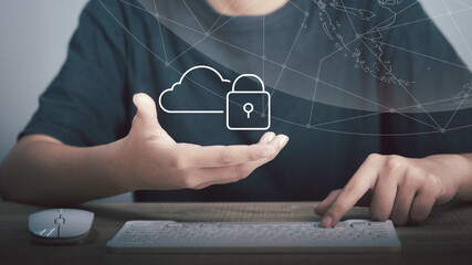Cloud security technology protection concept. Hand hold Cloud with Padlock icon and keyboard,  Upload backup data on the cloud keep for privacy database.