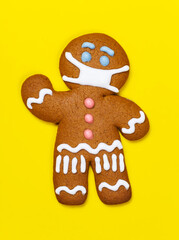 Gingerbread man with protective medical mask. Happy New Year festive background