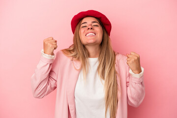 Young Russian woman isolated on pink background shocked, covering mouth with hands, anxious to discover something new.